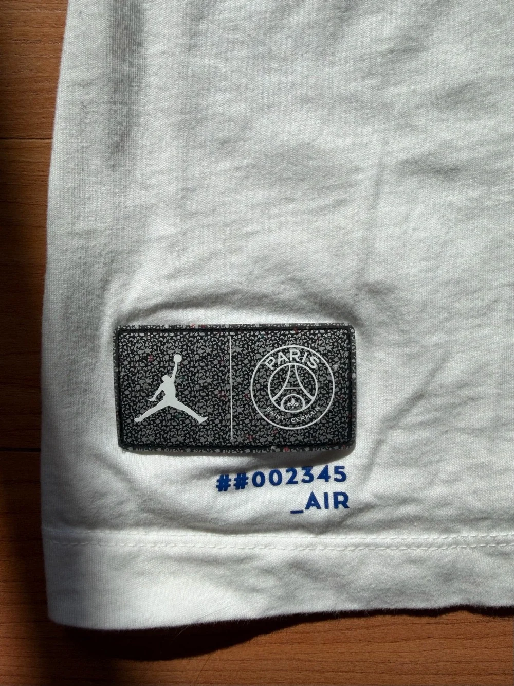 Jordan White Short-Sleeve Tee with Blue PARIS Graphic